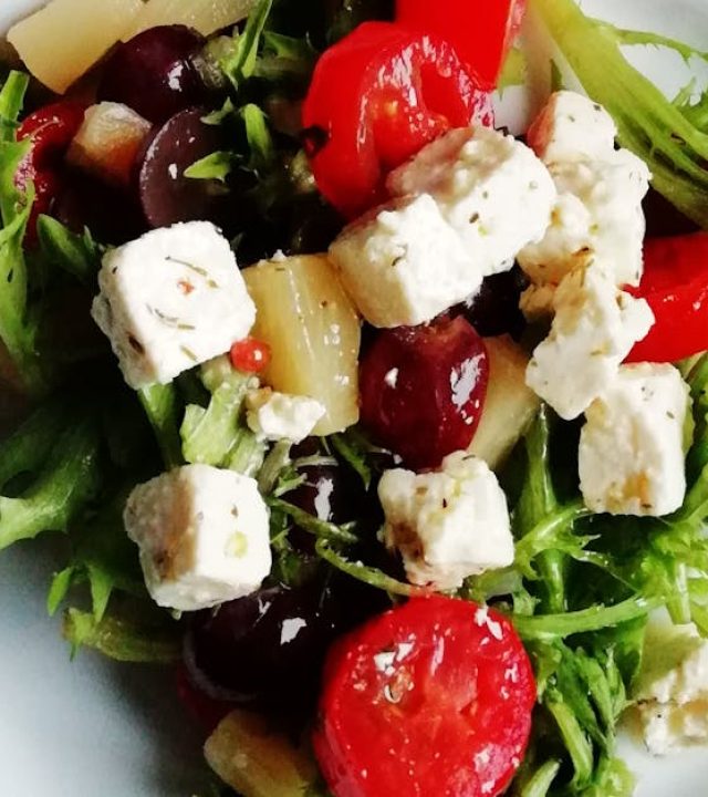 Delicious Greek salad featuring fresh vegetables and creamy feta cheese, perfect for a healthy meal.